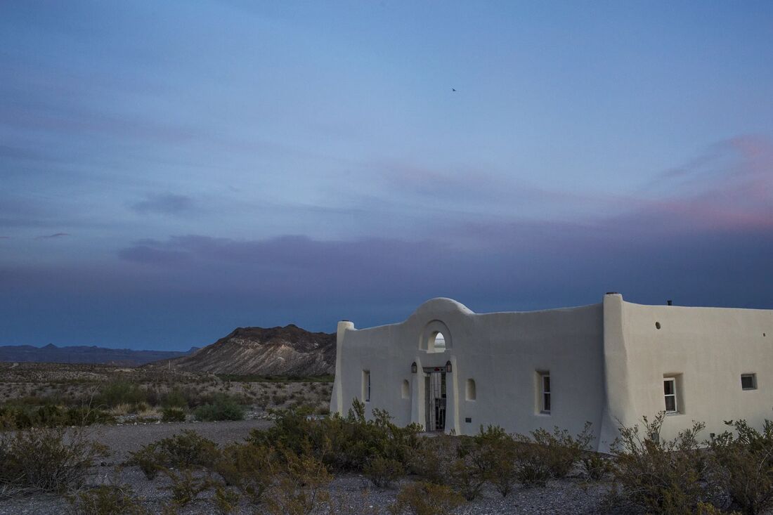 An adobe building at dusk in West Texas