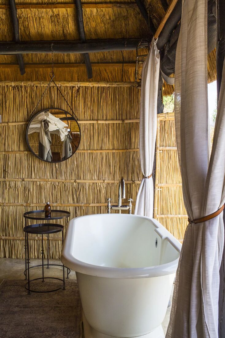 A freestanding bathtub in a safari tent, Lower Zambezi